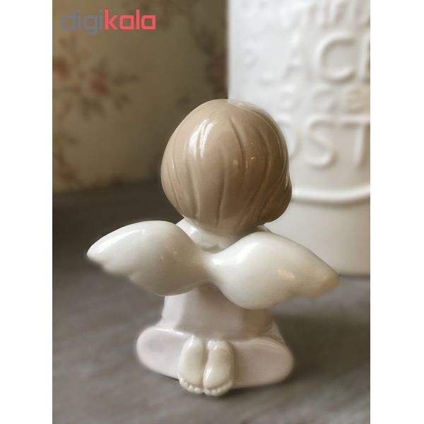 مجسمه سرامیکی خانه سفید مدل فرشته قلب به دست